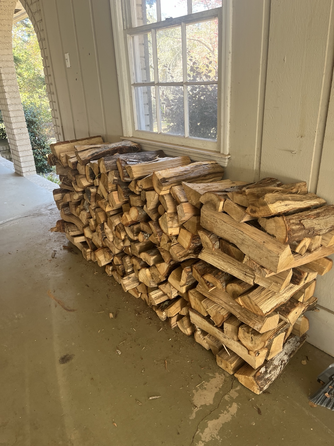 Firewood neatly stacked at a customer's home