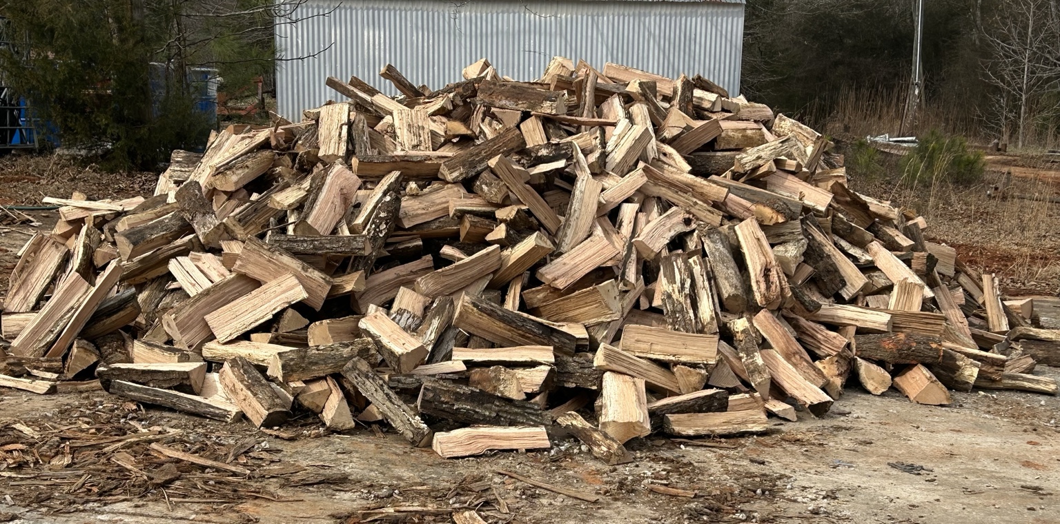 Large pile of freshly split firewood