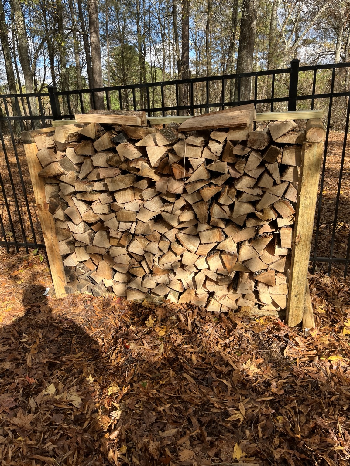 Seasoned firewood stored in an outdoor rack