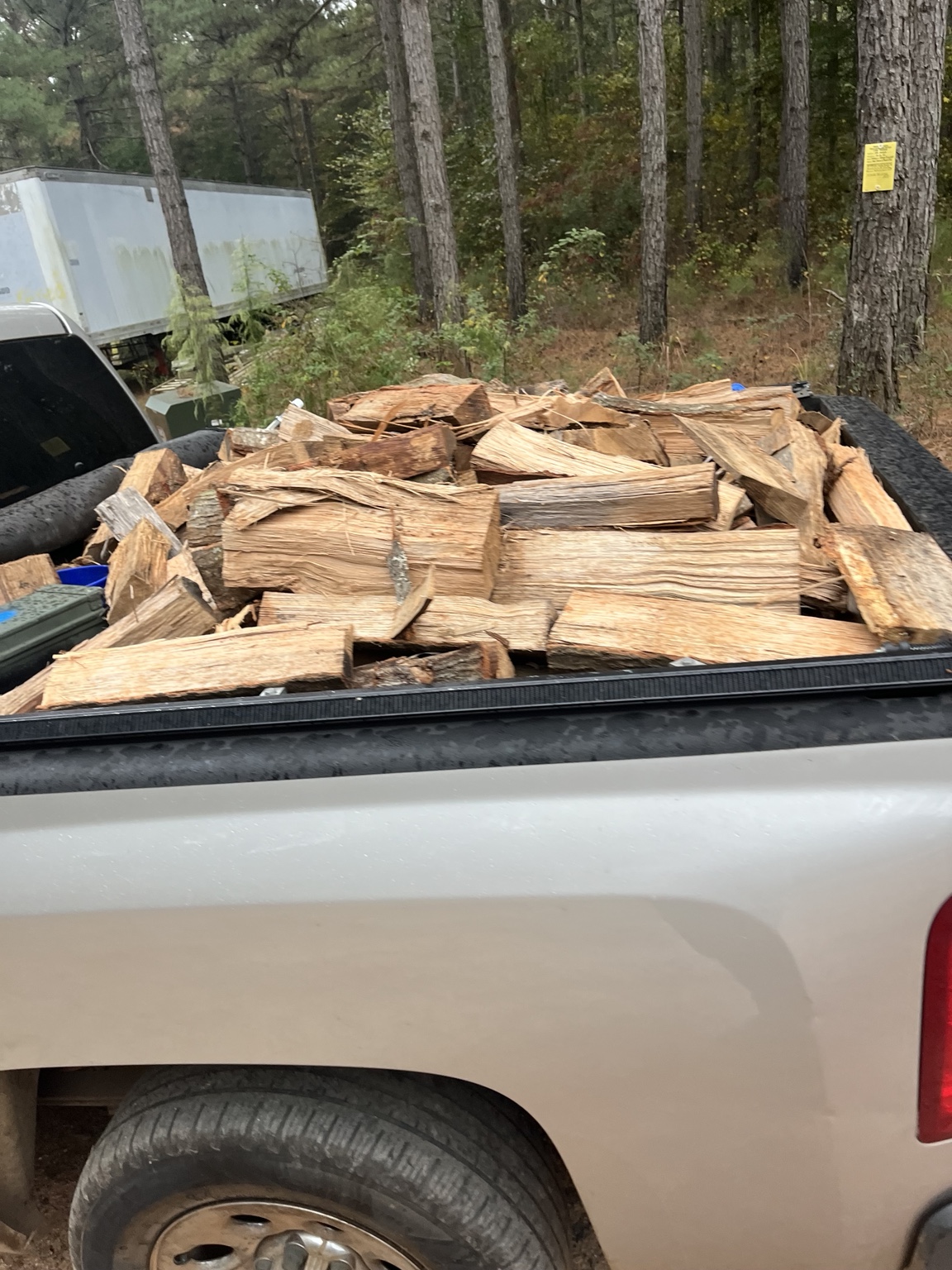 Pickup truck loaded with split firewood